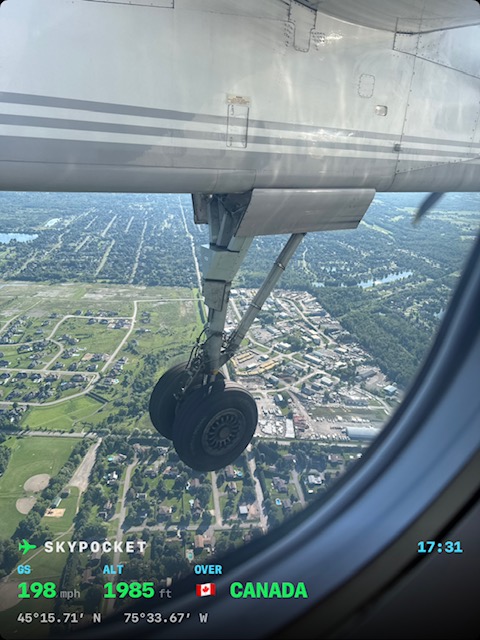 Real photo on approach into Ottawa: the main landing gear down over the suburbs, stamped 198 mph at 1,985 ft